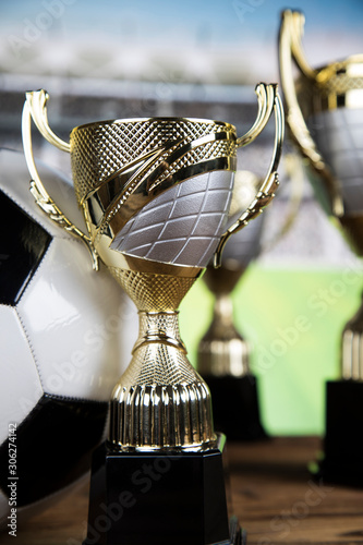 Award winning and championship concept, trophy cup on sport background photo