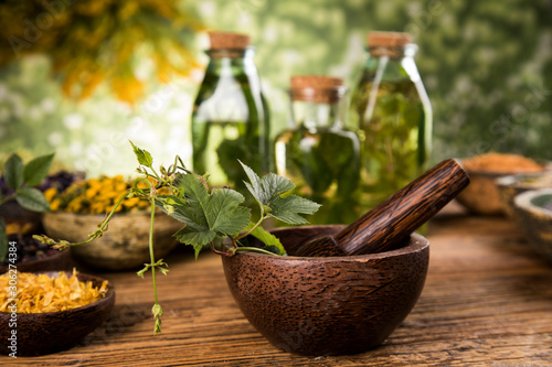 Herbs medicine and vintage wooden background photo