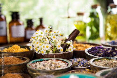 Herbs medicine and vintage wooden background