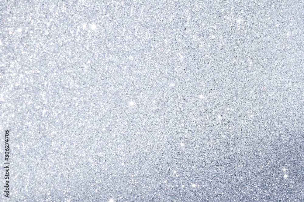 sparkles of silver glitter texture background