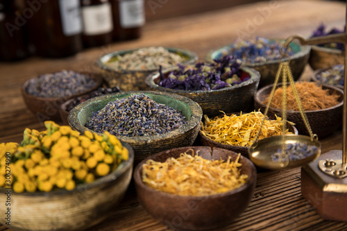 Herbs medicine and vintage wooden background © Sebastian Duda