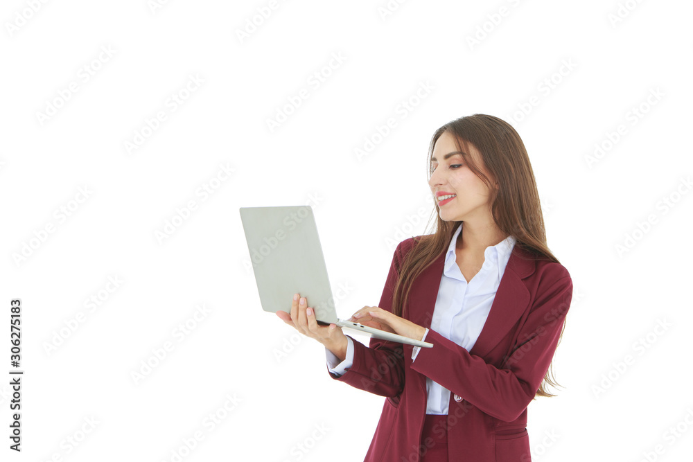 Smiling beautiful woman in red dress holding laptop on right hand isolated on white background - working and business woman concept Smiling beautiful woman in red dress holding laptop on right hand isolated on white background - working and business woman concept