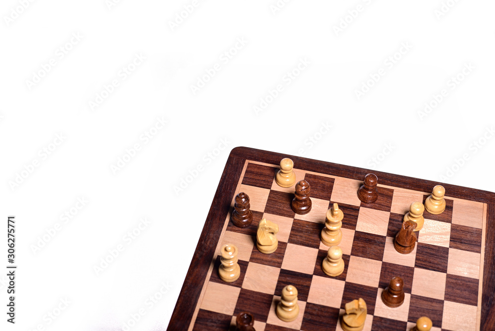 Top angle shot of chess pieces on chessboard against white background. Wooden chess pieces. Top angle shot of chess pieces on chessboard against white background. Wooden chess pieces.