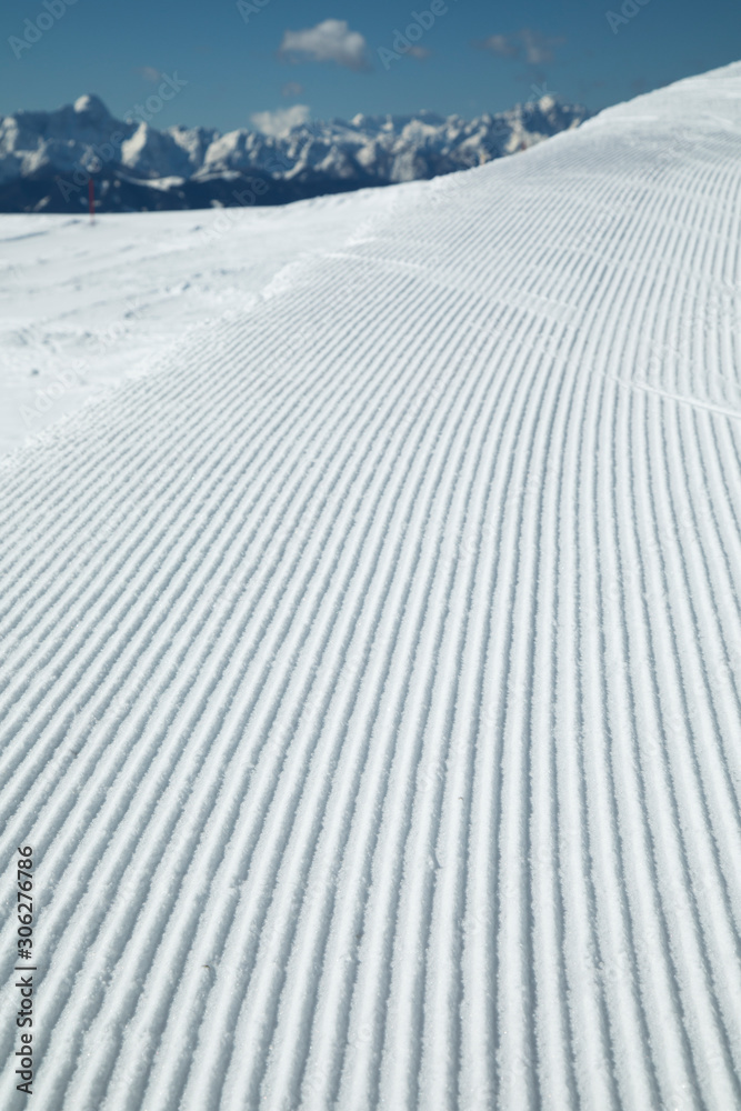 Fresh snow on ski slope, winter landscape
