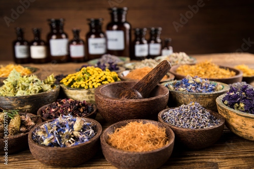 Natural remedy Herbal medicine and wooden table background