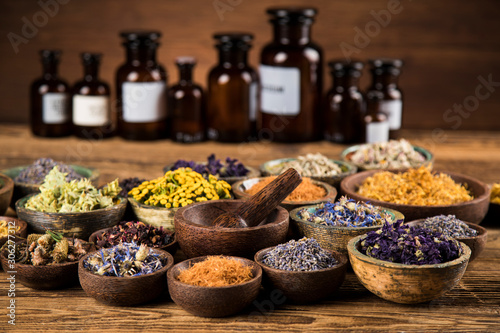 Natural remedy Herbal medicine and wooden table background