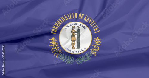 Crease of Kentucky fabric flag background. The Commonwealth's seal on a navy blue field and the words 