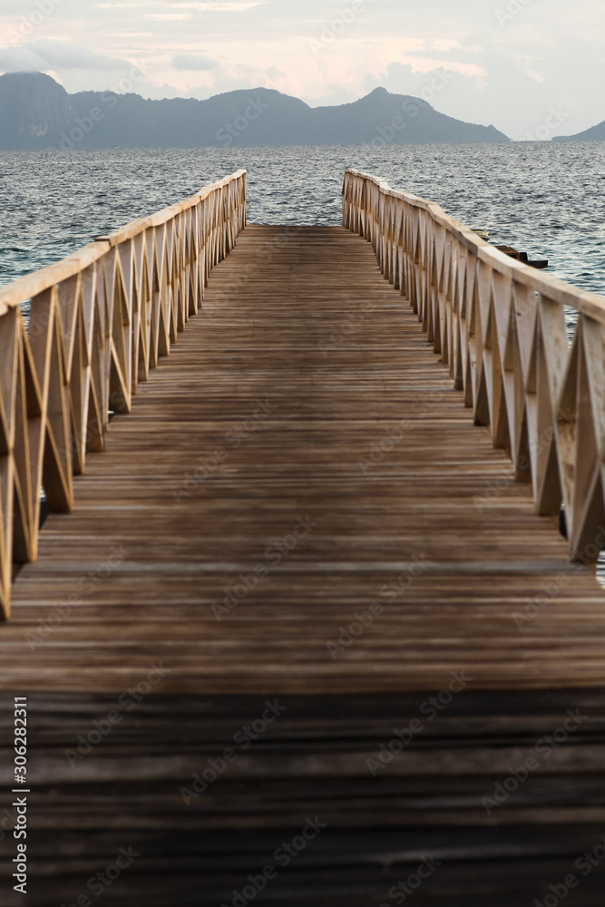 Fototapeta premium Wooden bridge during the sunrise near the Bum bum island in Semporna, Borneo Sabah.