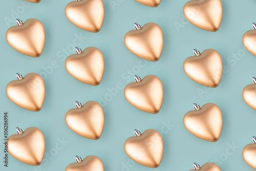 Seamless background from golden hearts. Christmas pattern.