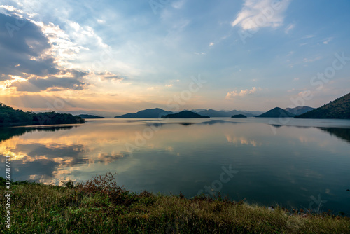 beautiful blue sky green forest mountains lake view at Kaeng Krachan National Park  Thailand.  an idea for backpacker hiking on long weekend or a couple  family holiday activity camping relaxing