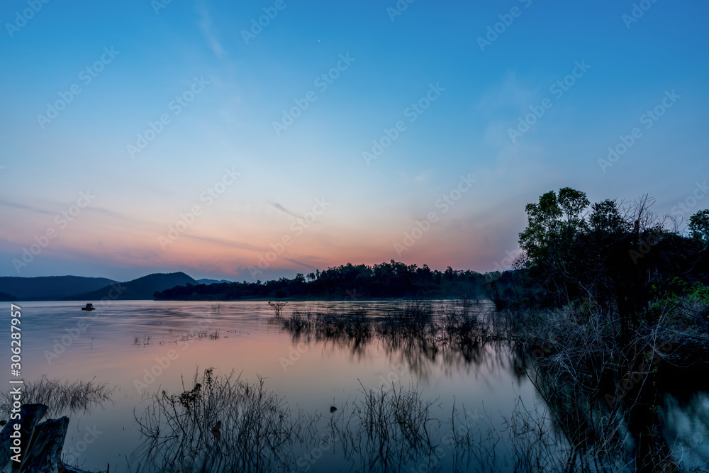 Fototapeta premium beautiful blue sky green forest mountains lake view at Kaeng Krachan National Park, Thailand. an idea for backpacker hiking on long weekend or a couple, family holiday activity camping relaxing