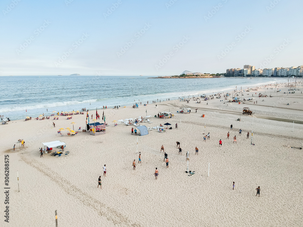 aerial drone view of Copacabana beachs during late afternoon,, some shadows can be seen on the sand. Rio de Janeiro, Brazil