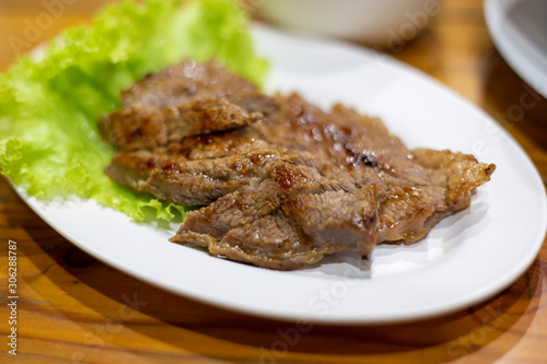 Beef roasted sliced in dish Thai traditional style.