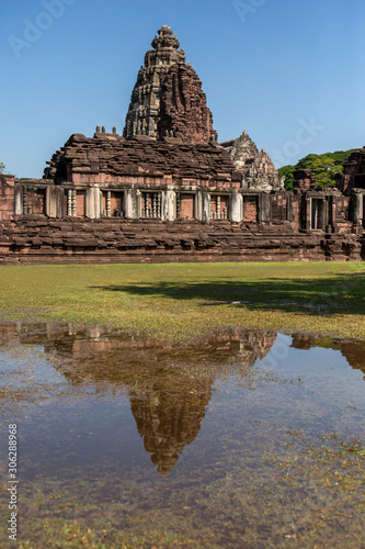 The Phimai castle historical park is the largest ancient Khmer temples with reflection in the water. Prasat Hin Phimai beautiful sandstone castle in Thailand.