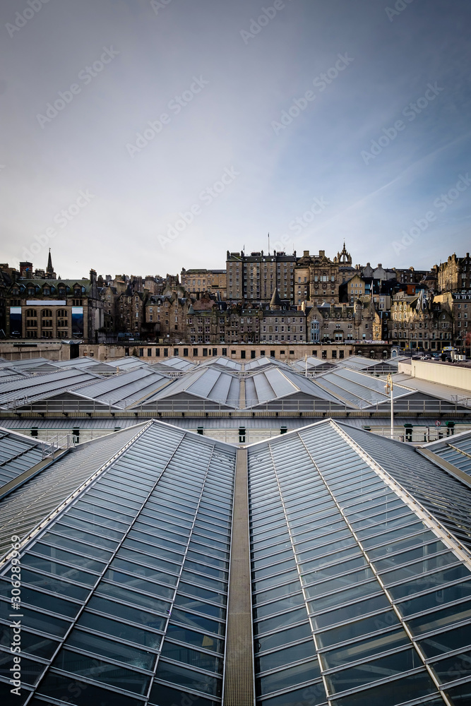 View of Edinburghs Market Street as seen from Waverly Station, with the stations glass ceiling in the foreground. Edinburgh, Scotland