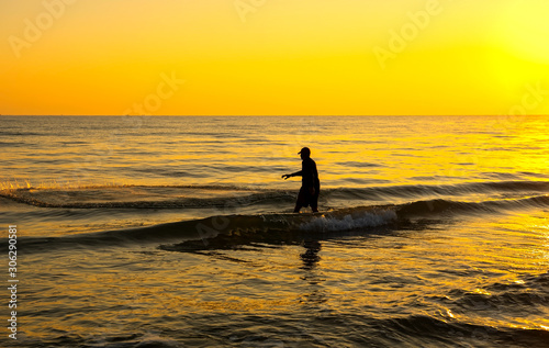 The fisherman cast a net the sea in the morning, at sunrise, Songkhla Thailand