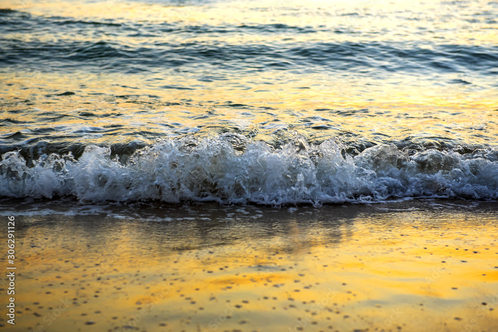 The sea with waves hit the sandy beach in the morning, with copy space text The sea with waves hit the sandy beach in the morning, with copy space text
