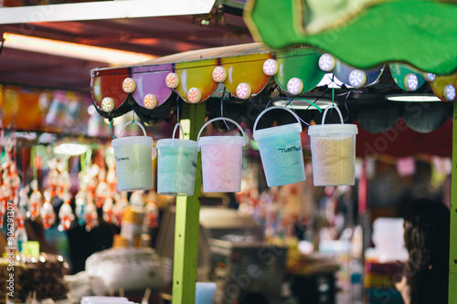 Colorful candy pots hanging on a party shop on a merry-go-round