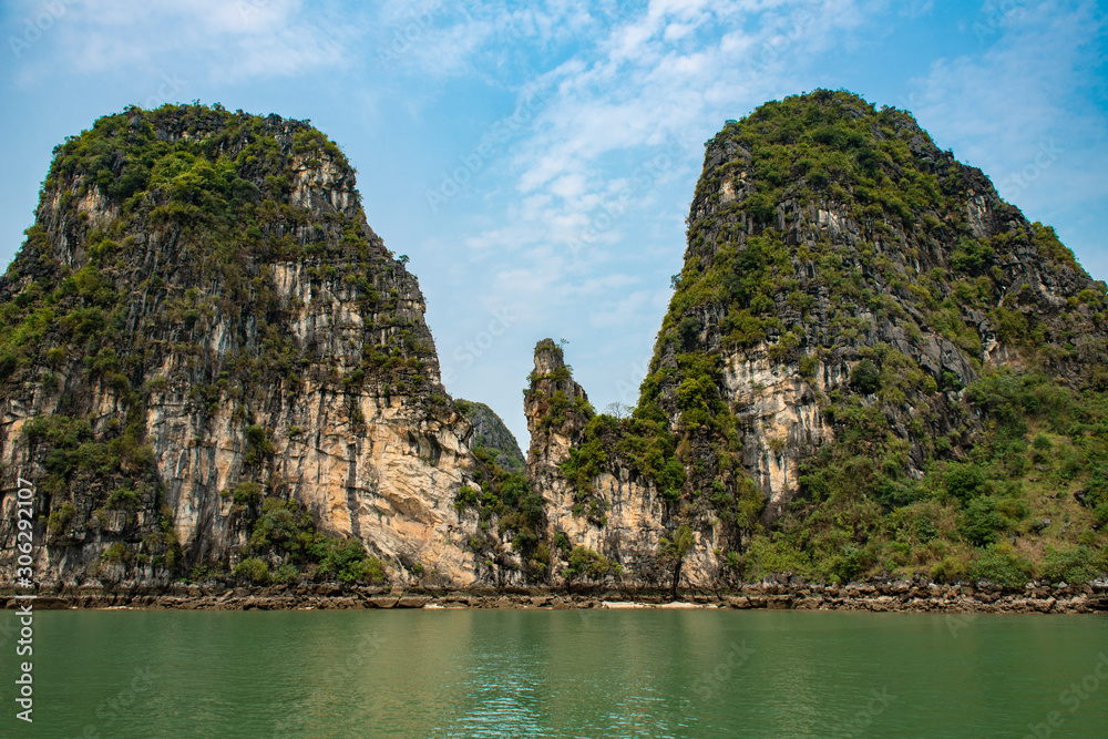 Beautiful island landscape of Halong Bay the UNESCO world heritage site in Vietnam. The bay features thousands of limestone karsts in various shapes and sizes. Beautiful island landscape of Halong Bay the UNESCO world heritage site in Vietnam. The bay features thousands of limestone karsts in various shapes and sizes.