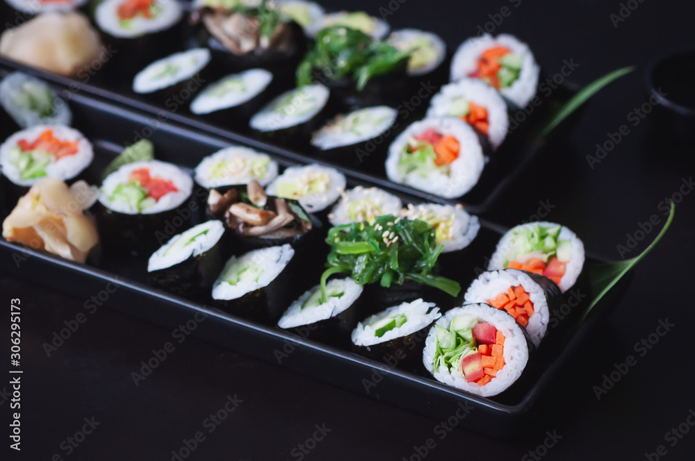 Two vegetarian sushi platter with maki, futomaki and gunkans. Two vegetarian sushi platter with maki, futomaki and gunkans.