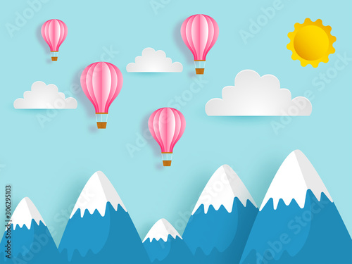 Paper cut style landscape background with hot air balloon, clouds and sun.