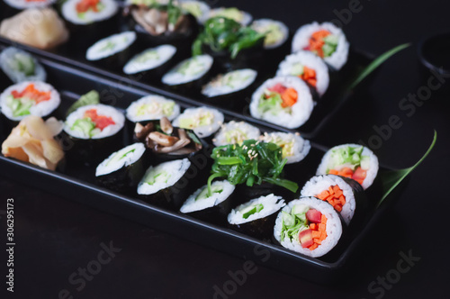 Two vegetarian sushi platter with maki, futomaki and gunkans.