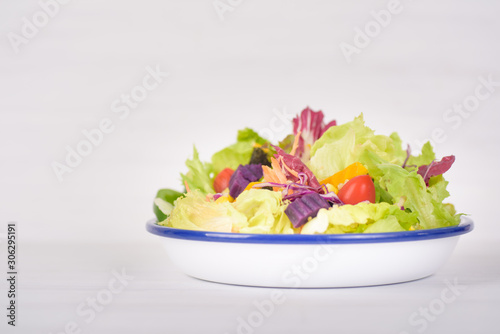 Healthy vegetable salad bowl on white background