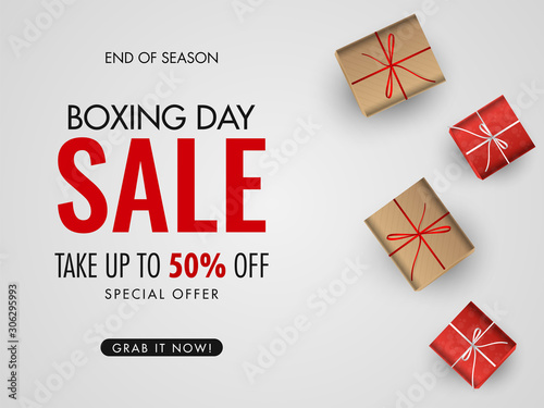 Boxing Day Sale poster or banner design with 50% discount offer and top view of gift boxes on white background.