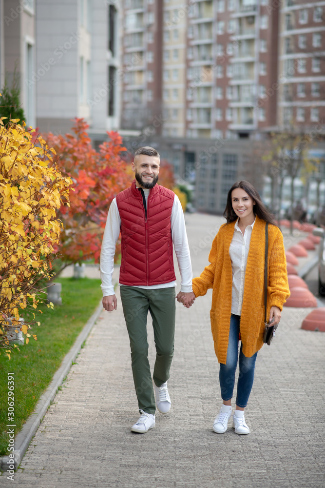Joyful young people having a romantic walk Joyful young people having a romantic walk