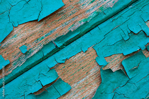 Texture of old wooden boards with peeling paint