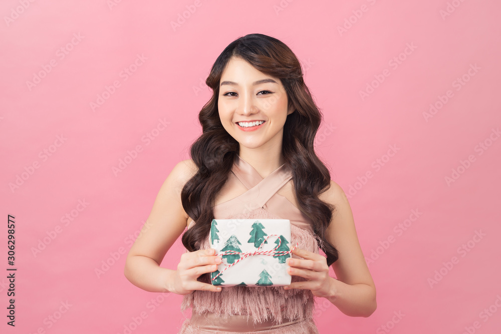 beautiful young asian woman holding present beautiful young asian woman holding present