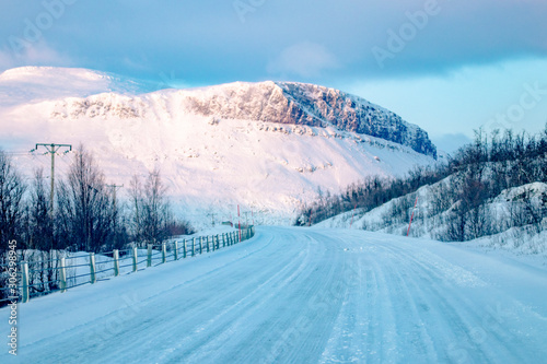 Snowy icy road, winter in Norway, beautiful winter landscape