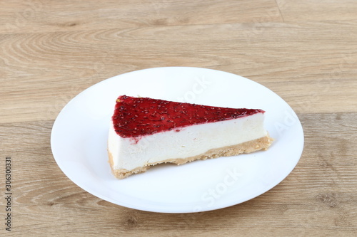  cheesecake with cherry jelly - Strawberry cheese cake isolated on a wooden background 
