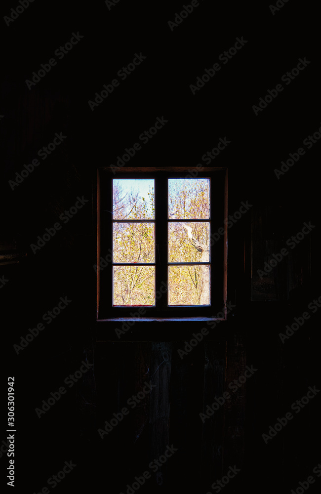Fototapeta premium Bright window on dark background.