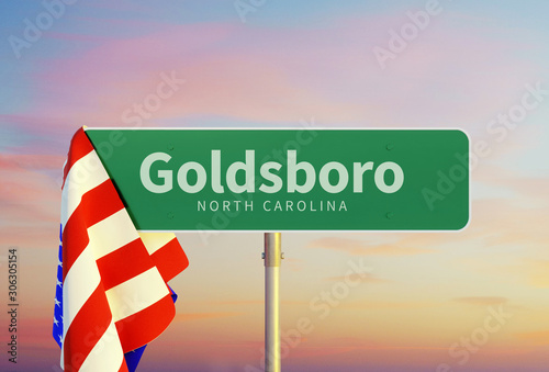 Goldsboro – North Carolina. Road or Town Sign. Flag of the united states. Sunset oder Sunrise Sky. 3d rendering photo