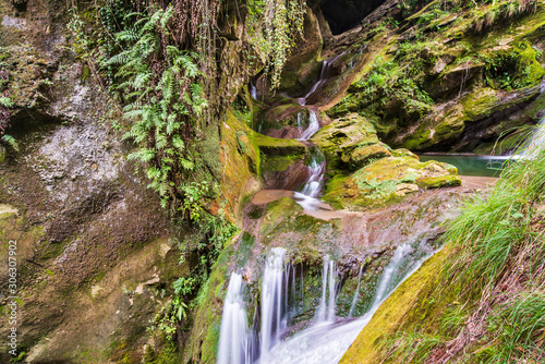 Caglieron caves and waterfalls. Magic of emerald. Vittorio Veneto, Italy photo