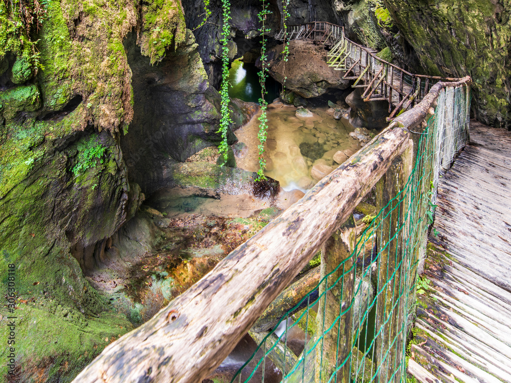 Fototapeta premium Caglieron caves and waterfalls. Magic of emerald. Vittorio Veneto, Italy