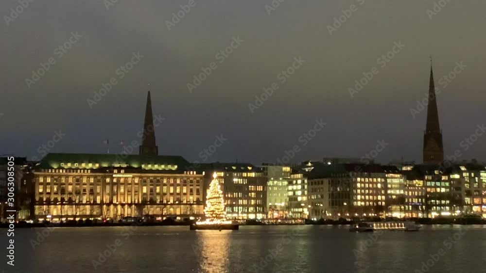 View of Hapag Lloyd's headquarters in Hamburg and a Christmas tree called Alstertanne View of Hapag Lloyd's headquarters in Hamburg and a Christmas tree called Alstertanne