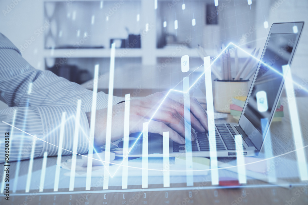 Double exposure of stock market graph with man working on laptop on background. Concept of financial analysis. Double exposure of stock market graph with man working on laptop on background. Concept of financial analysis.
