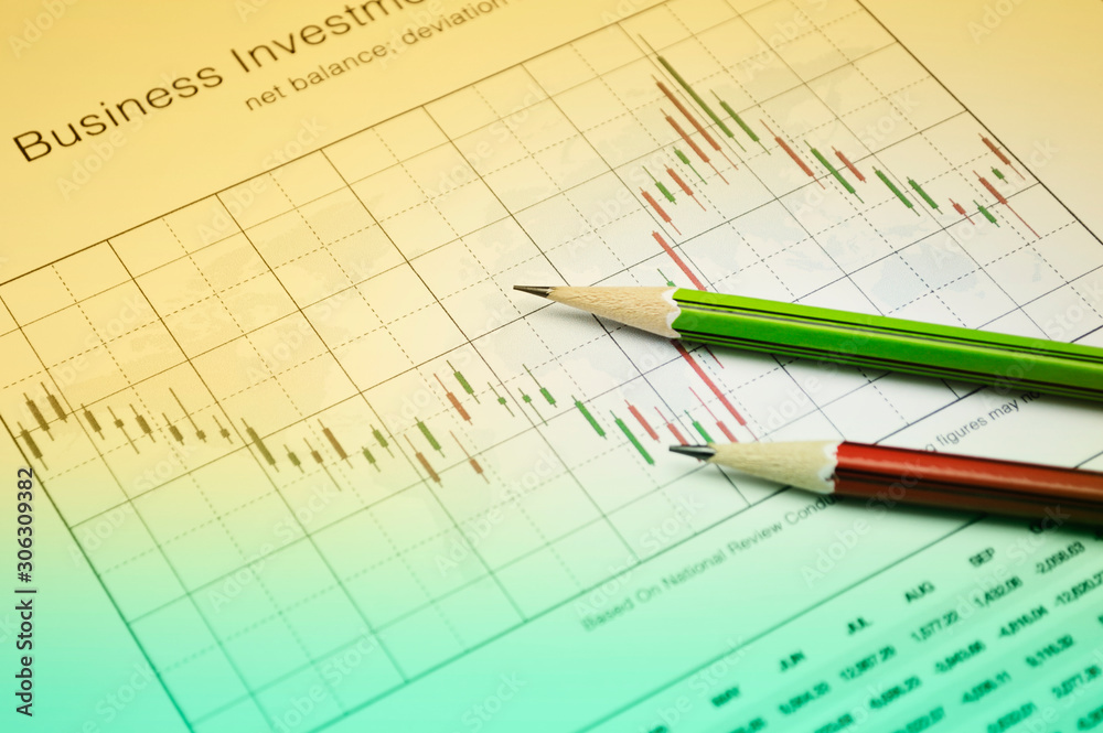 Pencil on stock market graph, Business investment concept Pencil on stock market graph, Business investment concept