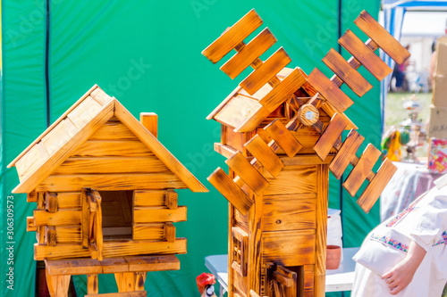 Russia, Samara, July 2019: an ethno-historical holiday with a reconstruction of the battle of Timur and Tokhtamysh in 1391. Sale of wooden models at the folk art fair photo