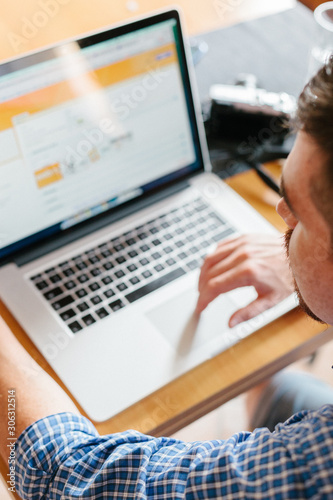 Man working with laptop at home
