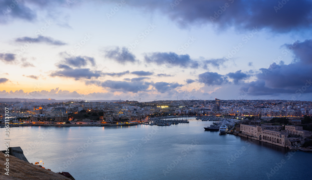 Malta. Panoramic view of Marsamxett Harbour from the city walls of Valletta in the evening.