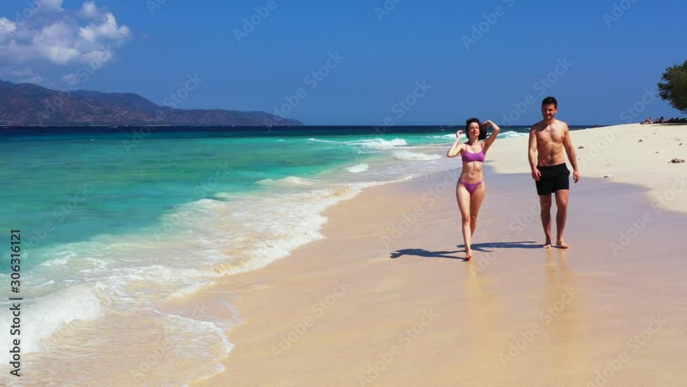 Fiji Island - A Pair Of Couple Walking While On The Shore Barefoot Under The Heat Of The Sun - Close-up Shot Fiji Island - A Pair Of Couple Walking While On The Shore Barefoot Under The Heat Of The Sun - Close-up Shot
