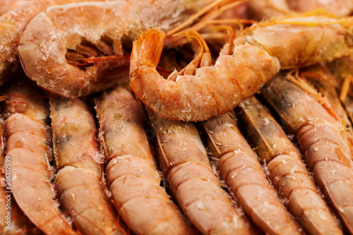 Background of frozen big shrimps closeup, sea food. photo
