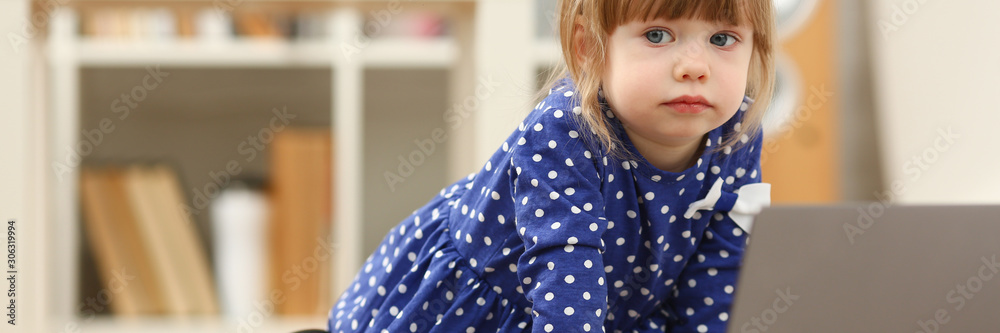 Cute little girl on floor carpet use laptop Cute little girl on floor carpet use laptop