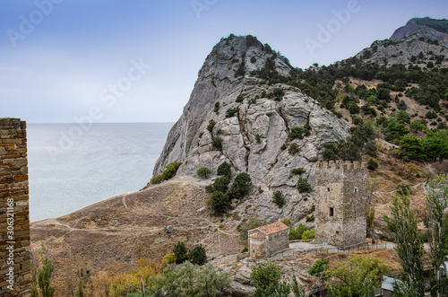 Mountain landscape, a small chapel by the mountain by the sea. View from the old fortress.