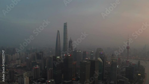 Shanghai Lujiazui business district Aerial with drone scene pan shot motion movement to central of city in morning sunrise time
