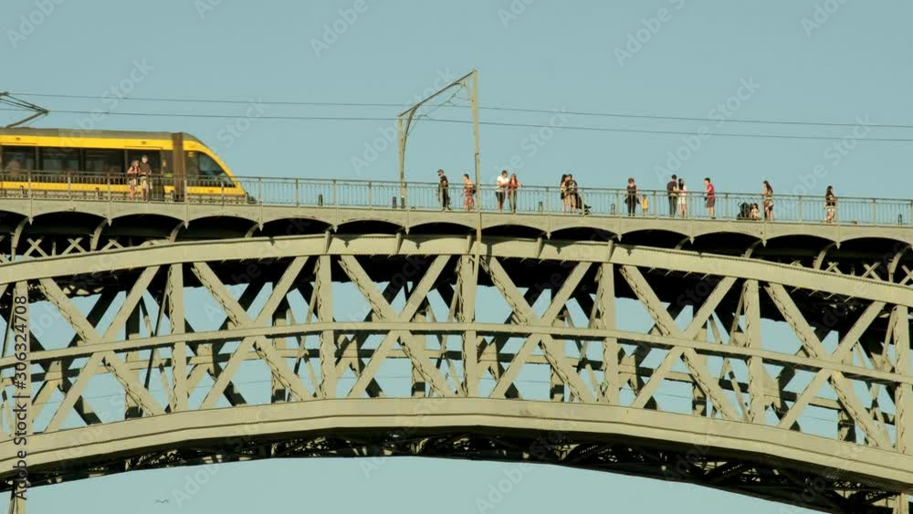 Tram crossing the arch of Ponte Luis in Porto, Portugal