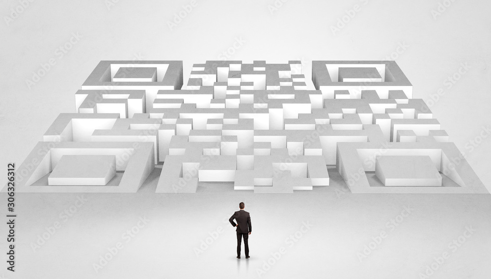 Businessman standing and thinking in top of a huge maze Businessman standing and thinking in top of a huge maze